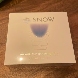 SNOW wireless teeth whitening kit. In original packaging and never opened.